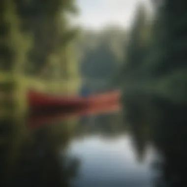 A picturesque view of a canoe gliding across a reflective lake, surrounded by lush greenery.