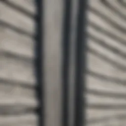Close-up of asbestos siding on an old house, showcasing its texture and condition.