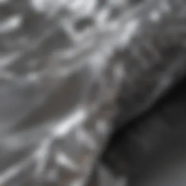 Close-up view of aluminum foil showcasing its reflective surface and flexibility