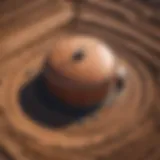 Aerial view of an oil tank site with visible soil disturbance.
